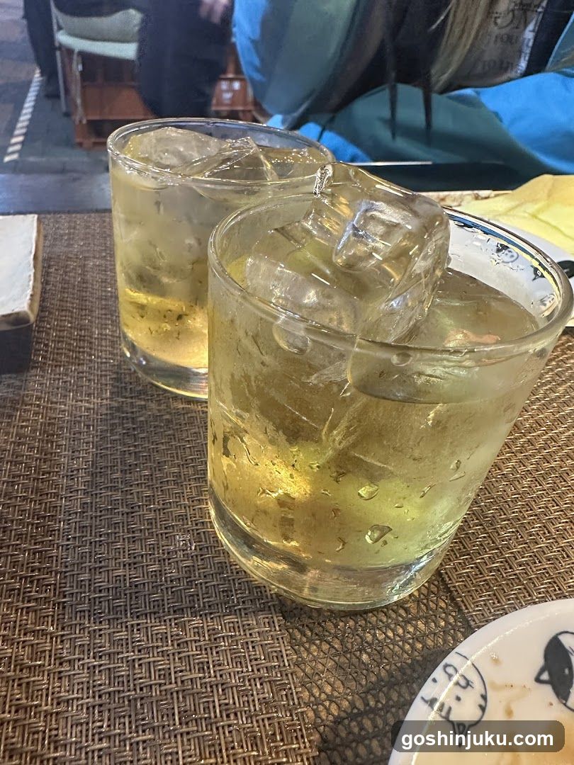 Two glasses of iced drink on a table