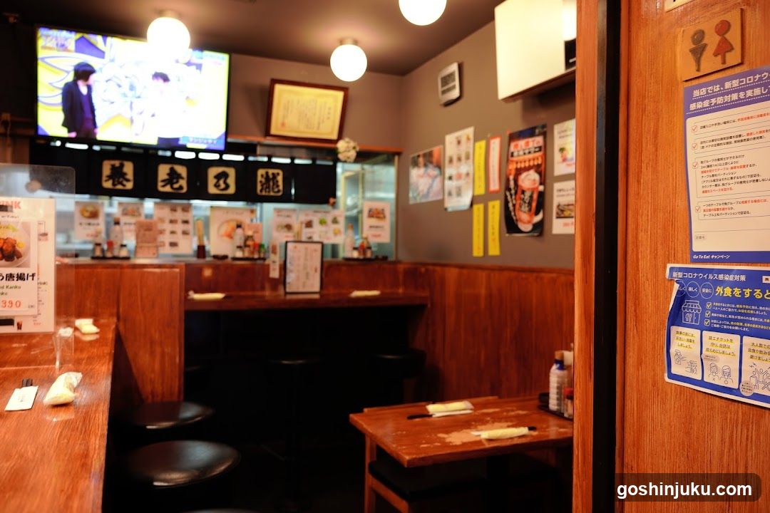 Restaurant Interior with TV and Posters