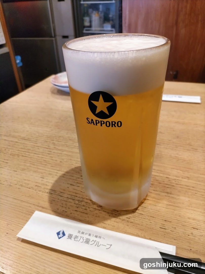 Sapporo Beer Glass on Wooden Table