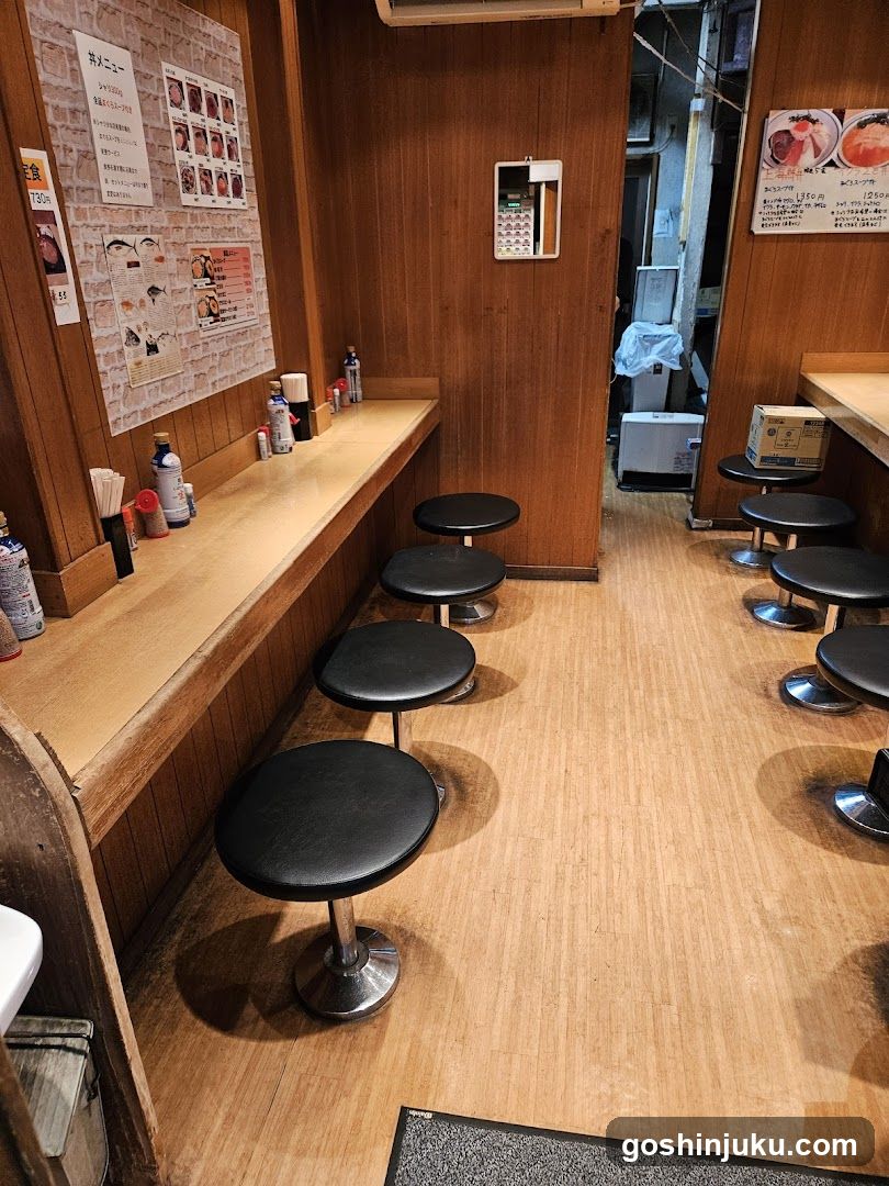Restaurant Interior with Wooden Seating and Menu Board