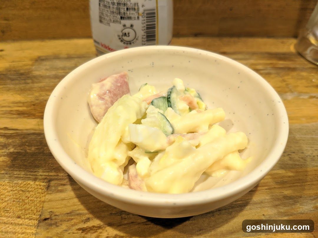 Bowl of Creamy Salad with Ham and Cucumber