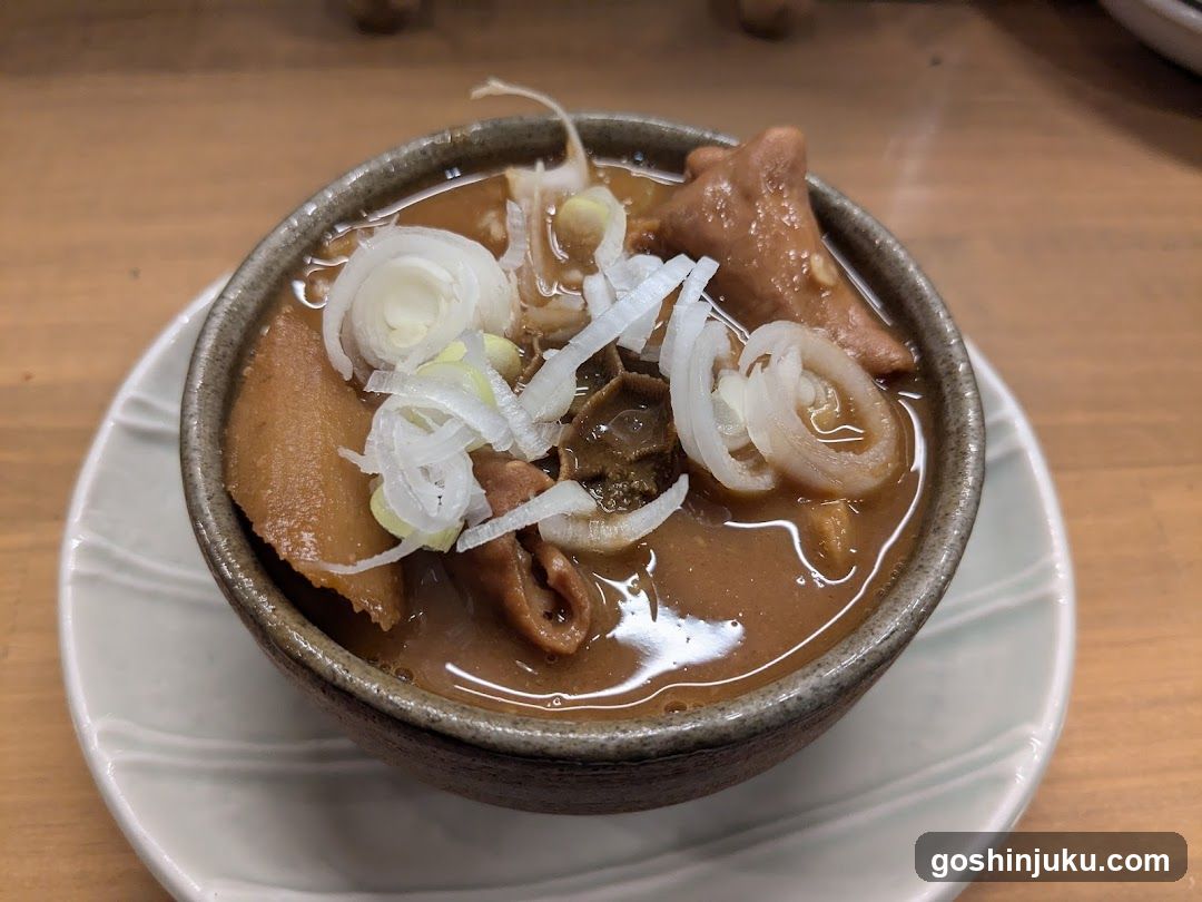Bowl of Japanese-style soup with meat and onions