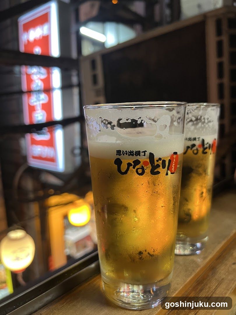 Beer glasses with condensation on a wooden surface
