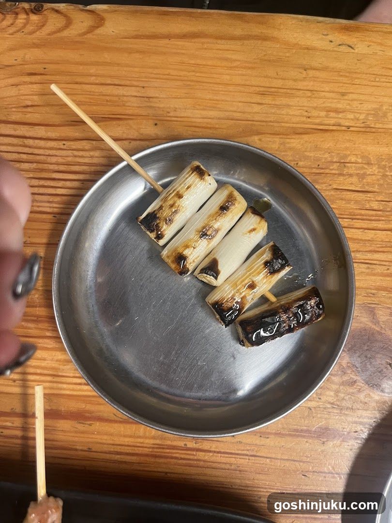 Grilled Leek Skewers on Metal Plate