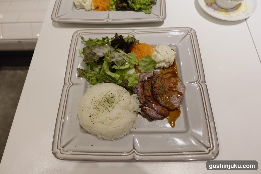 Plate of Food with Rice, Salad, and Meat