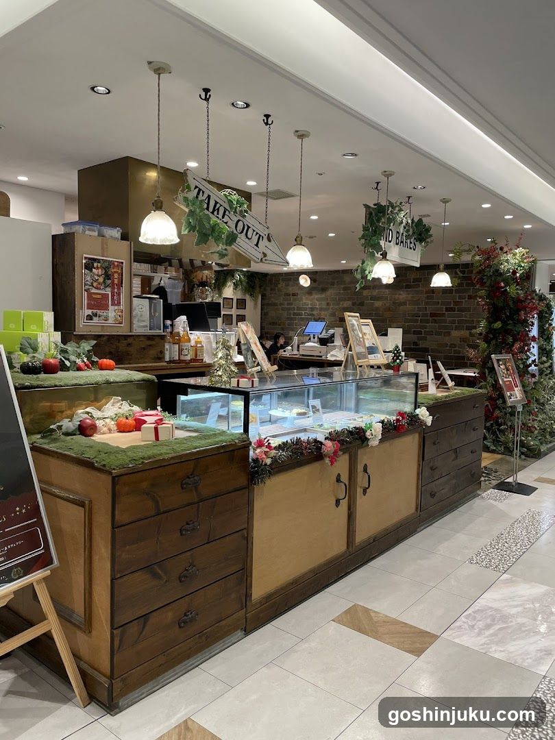 Interior of a bakery or cafe with wooden display counters and hanging signs.