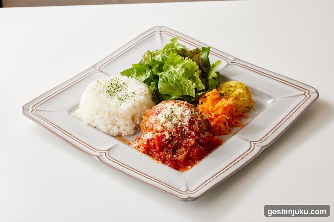 Plate of Food with Rice, Salad, and Stuffed Dish