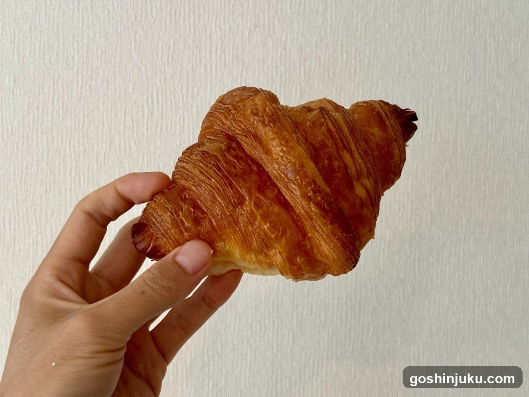 Croissant held in hand