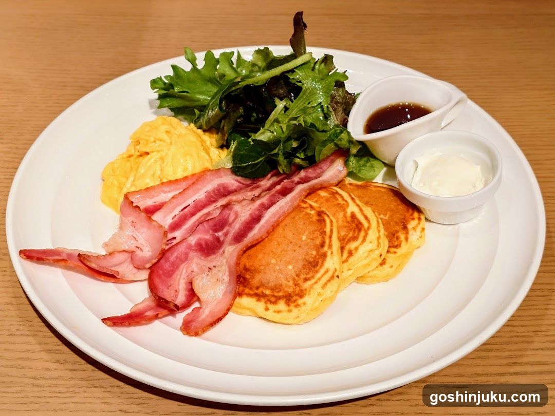 Breakfast Plate with Pancakes, Bacon, and Salad