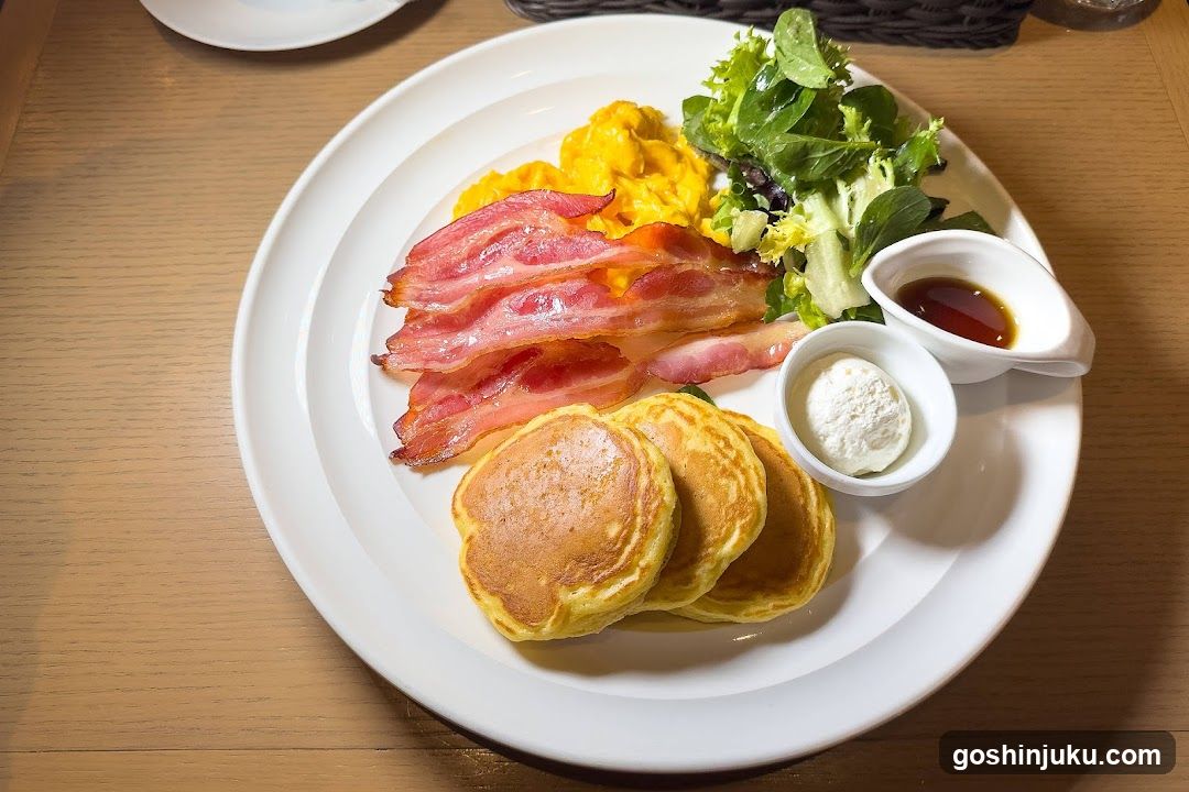 Breakfast Plate with Pancakes, Bacon, Eggs, and Salad