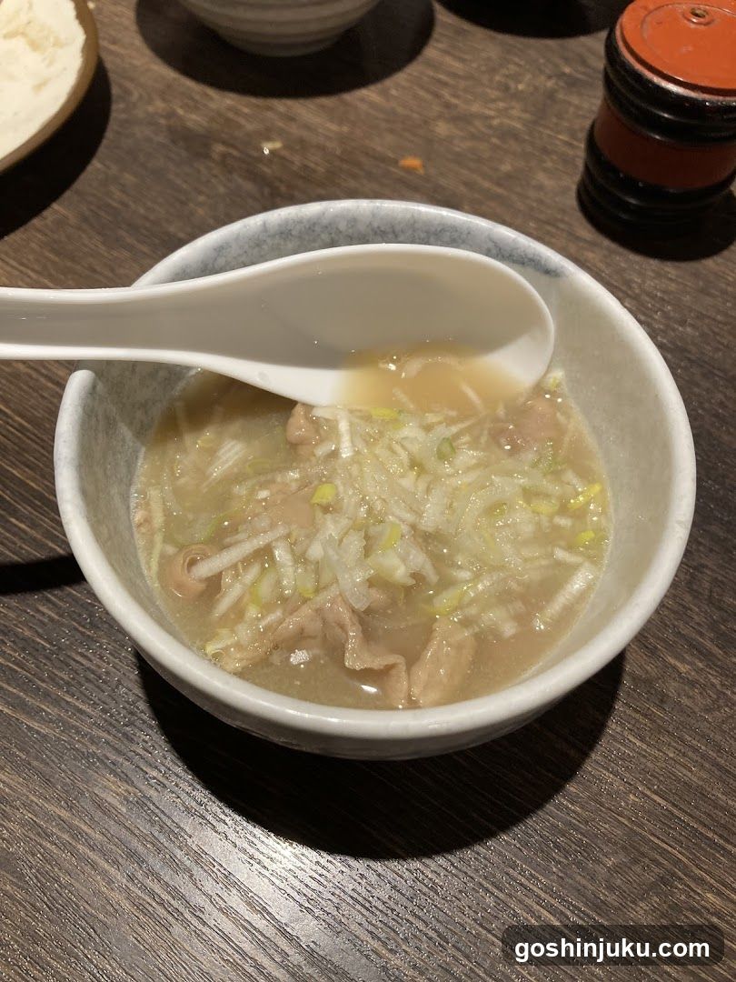 Bowl of Soup with Spoon