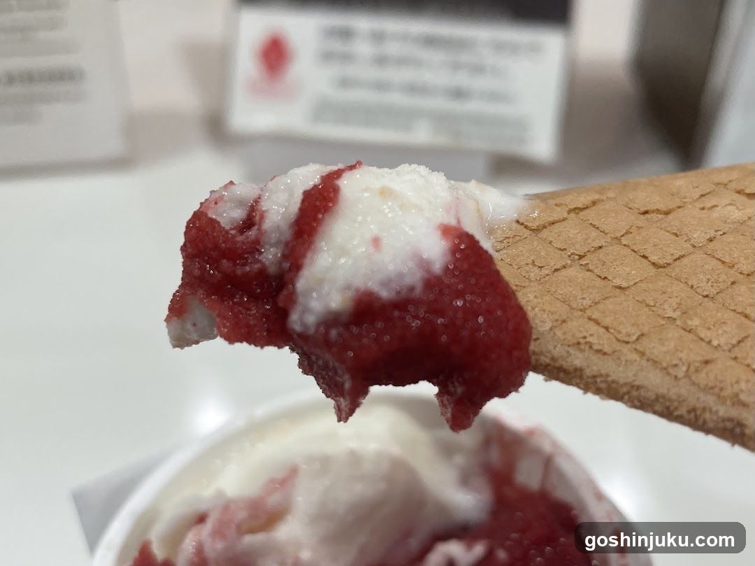 Ice cream cone with strawberry and vanilla flavors
