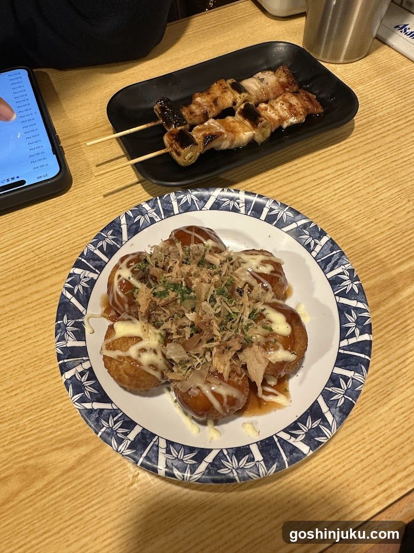 Okonomiyaki and Yakitori on a Wooden Table