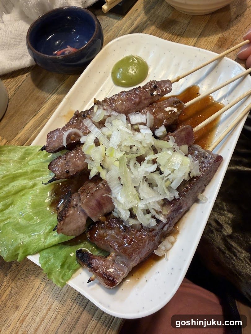 Grilled Meat Skewers with Onions and Sauce