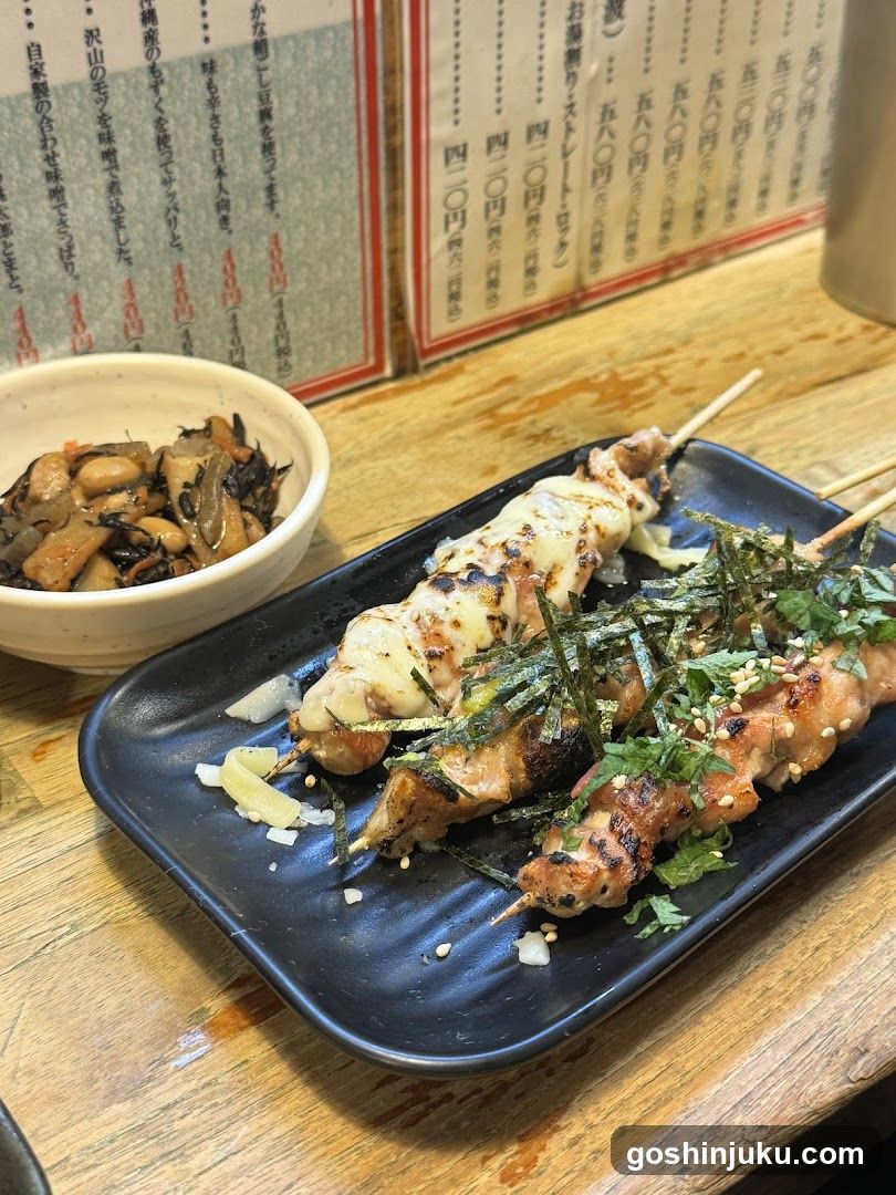 Yakitori and side dish on a wooden table