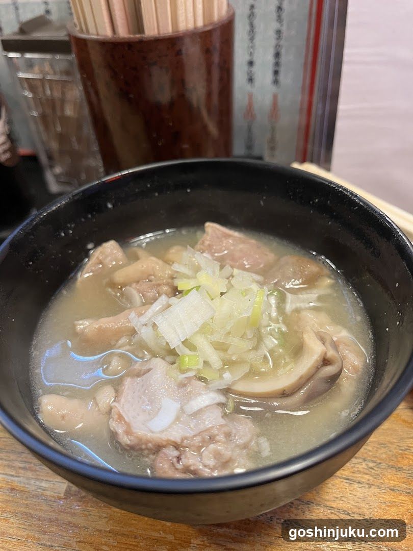 Bowl of Soup with Meat and Vegetables