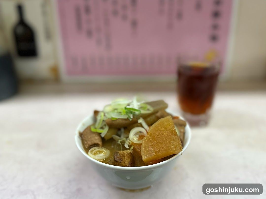 Bowl of stew with congee and drink