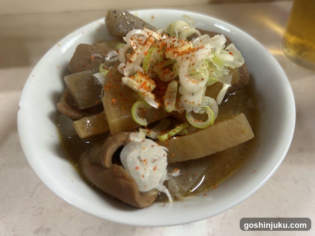 Bowl of Japanese-style soup with vegetables and garnish
