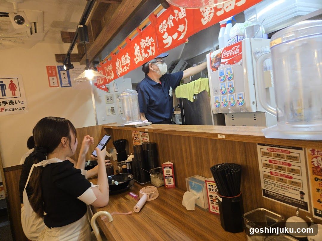 Restaurant Interior with Staff and Customer