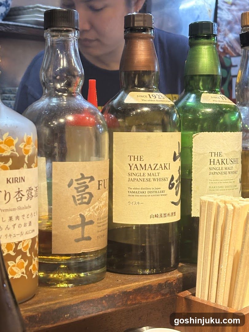Bottles of Japanese Whisky and Sake on a Shelf