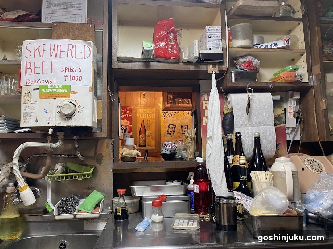 Kitchen Counter with Skewered Beef Sign