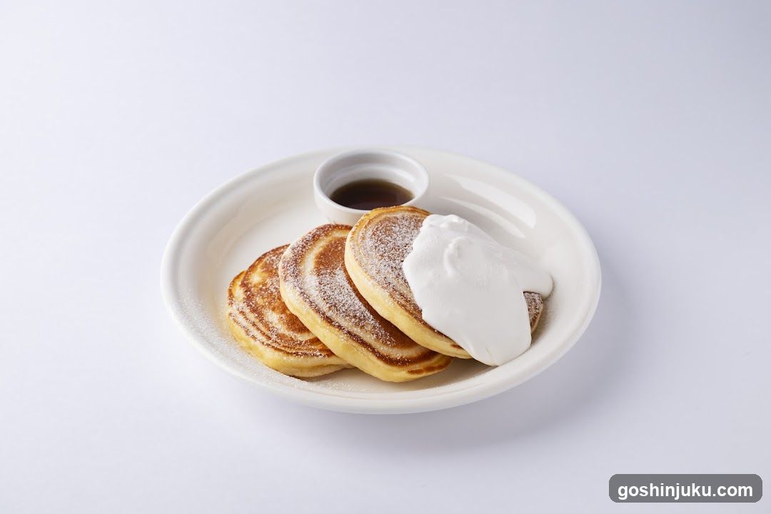 Pancakes with Whipped Cream and Syrup