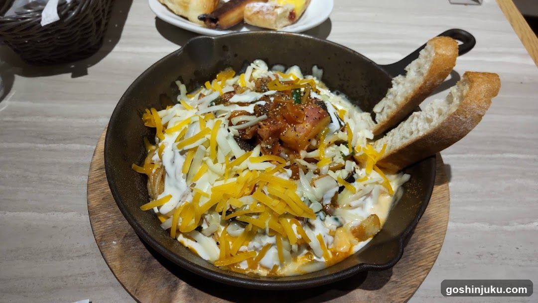 Cast Iron Skillet Dish with Cheese and Bread