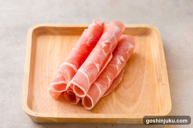 Raw Meat Slices on Wooden Tray