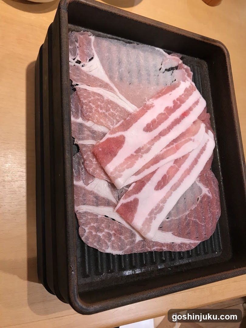 Raw Pork Slices on Grill Tray