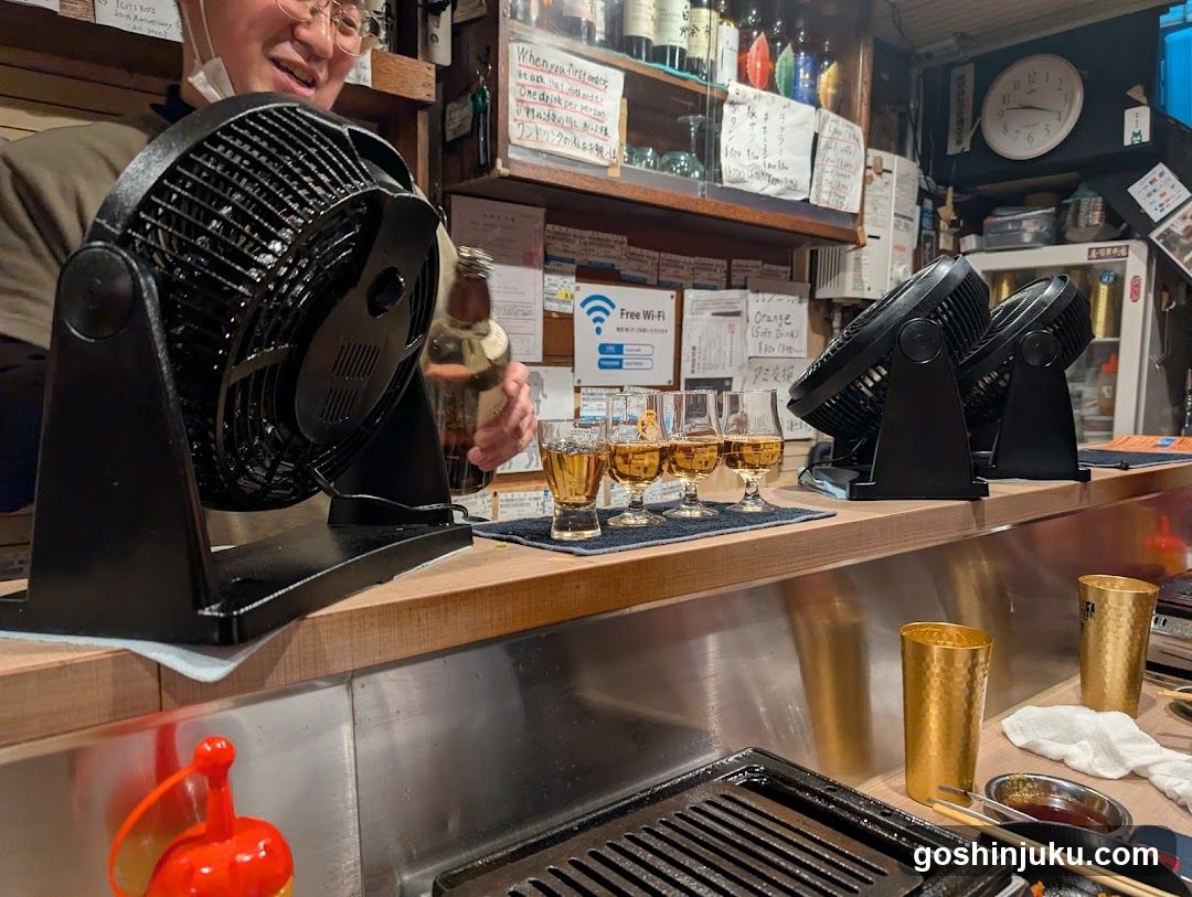 Bar Interior with Fans and Drinks