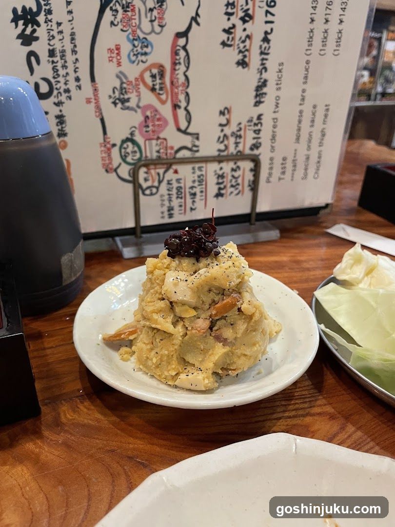 Yakitori dish with menu in background