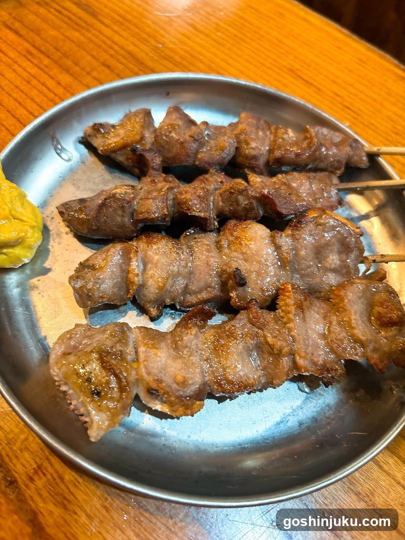 Grilled Meat Skewers on Metal Plate