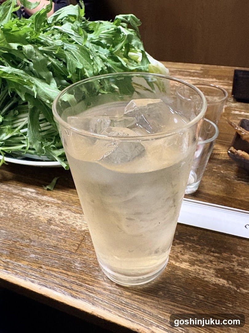 Iced Drink and Greens on Wooden Table