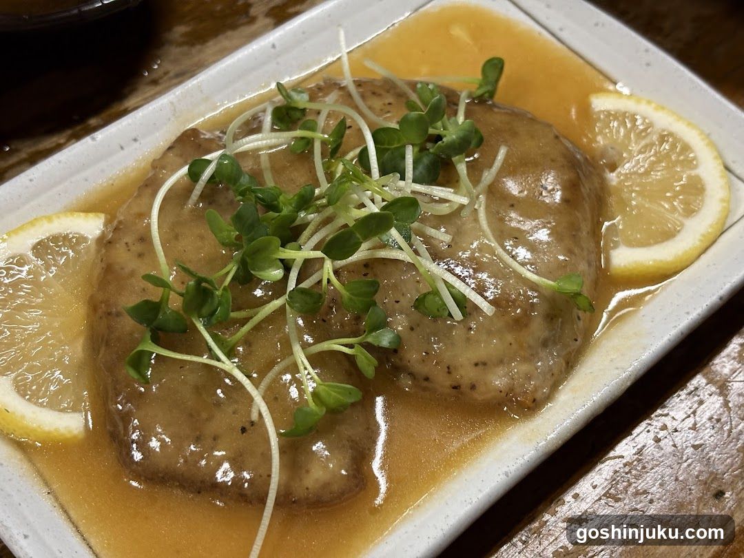 Sauced Meat with Microgreens and Lemon Slices