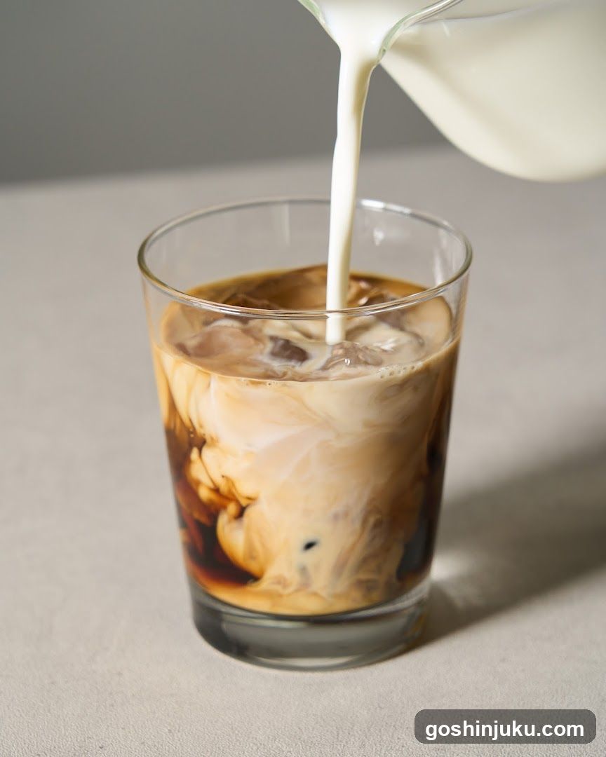 Iced Coffee with Milk Pouring