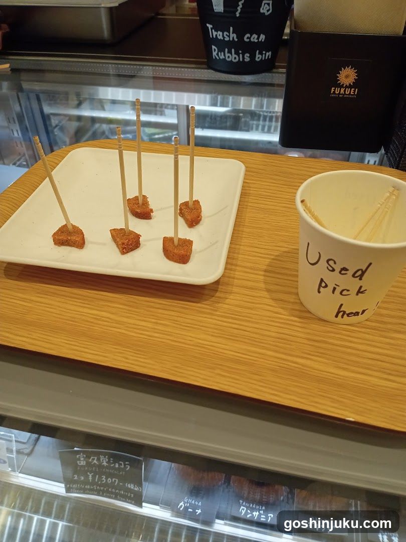 Food display with skewers and cup
