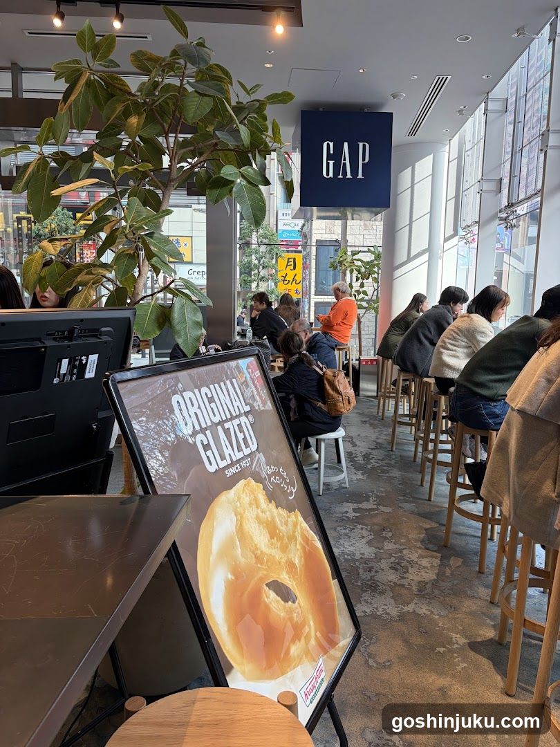Interior of a cafe with customers and signage