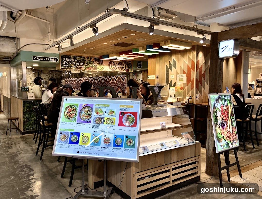 Food Court Interior with Menu Boards and Staff
