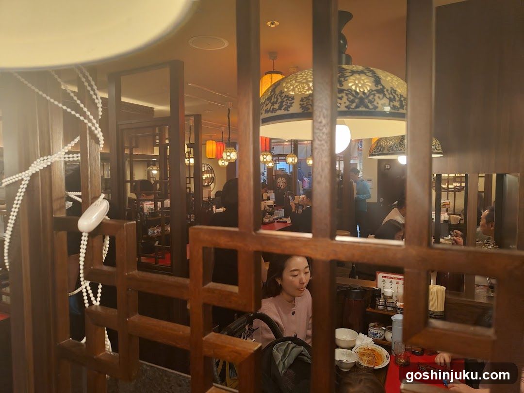 Restaurant Interior View Through Wooden Partition