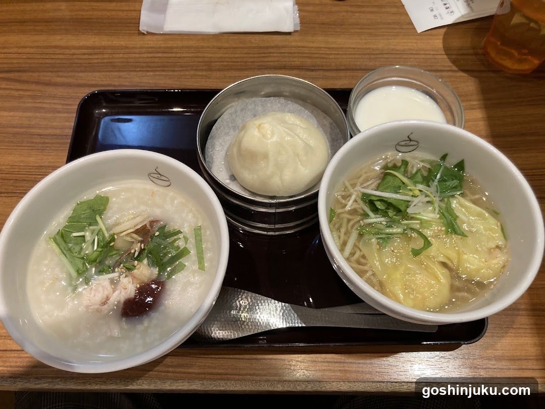 Breakfast Tray with Porridge, Noodles, Bun, and Milk