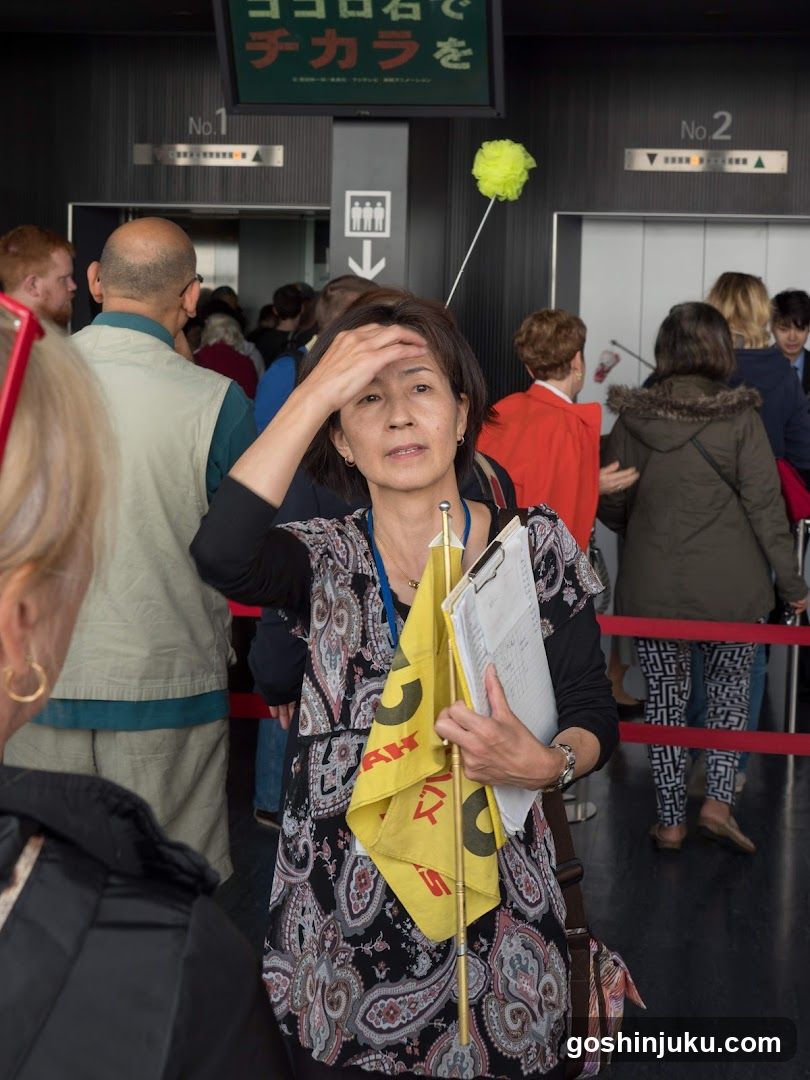 Woman with yellow flag at event entrance