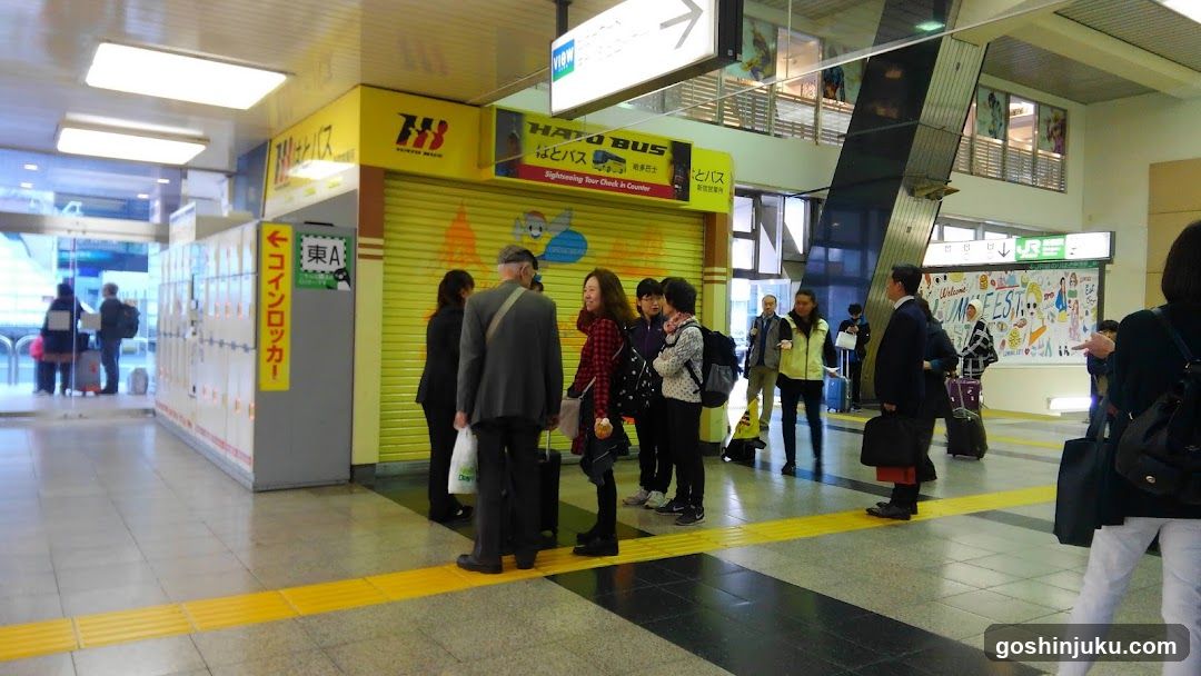 Station Interior with People Waiting