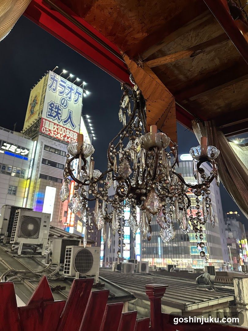 Chandelier with city lights in background