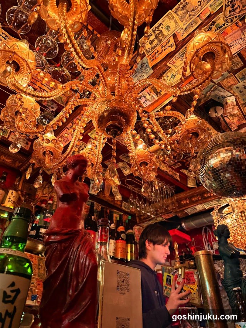 Bar Interior with Ornate Chandelier and Statues