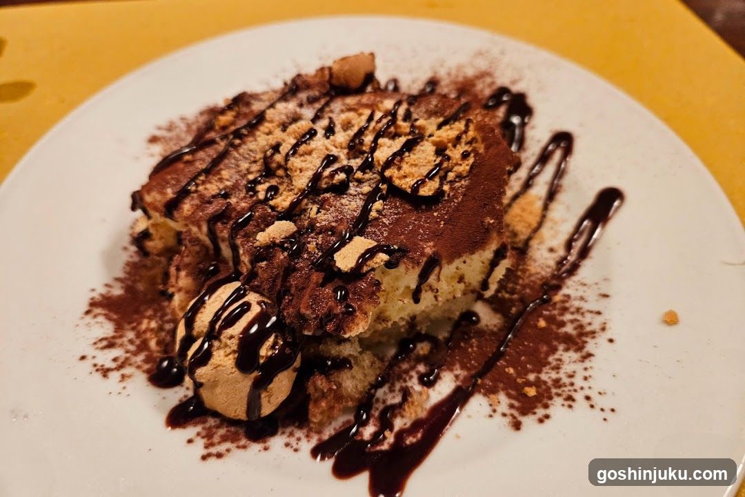 Tiramisu with Chocolate Drizzle and Crumbs