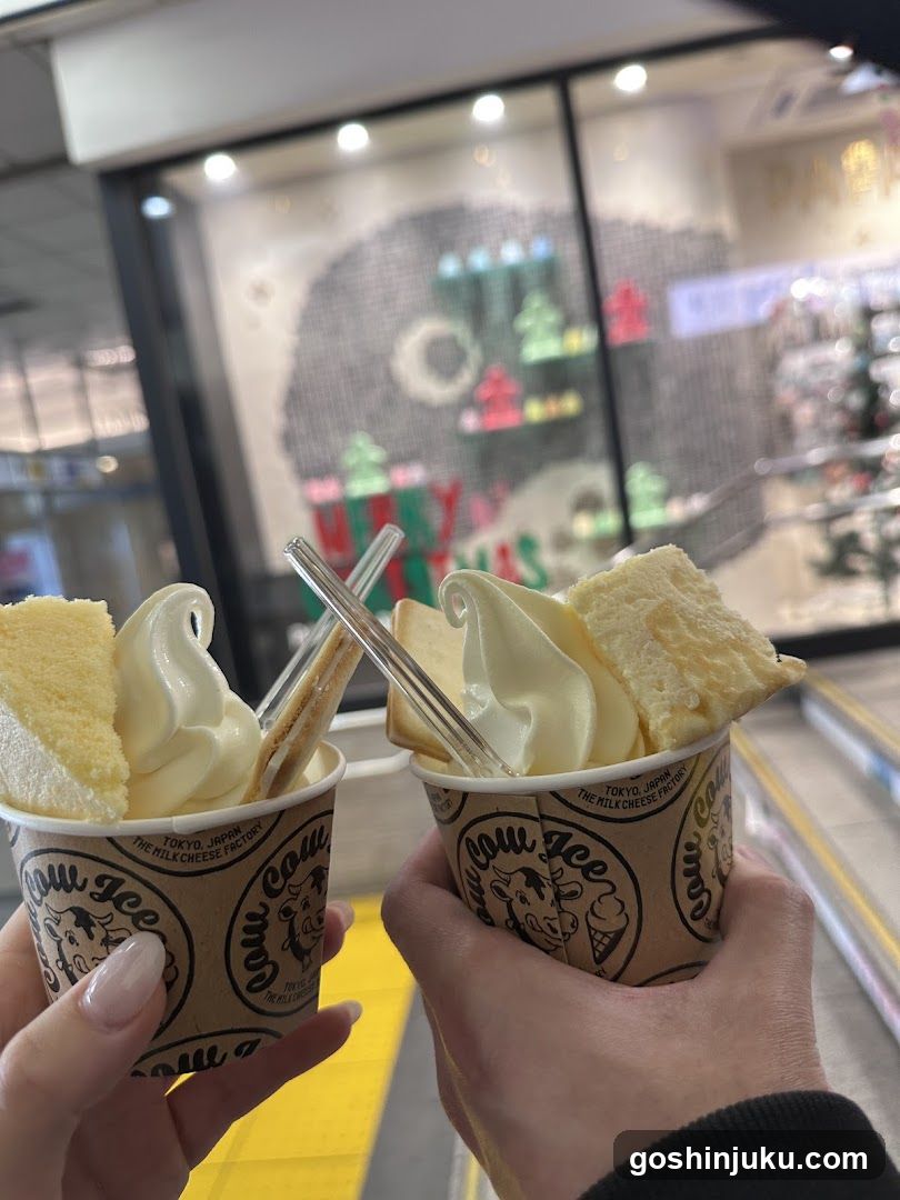 Soft serve ice cream cups with cake and straw
