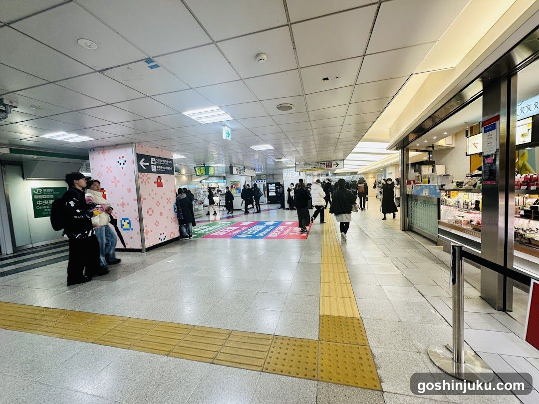 Station Interior with Shops and Pedestrians