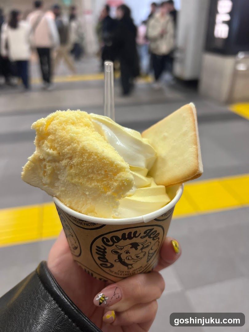 Ice cream cup with cake and whipped cream