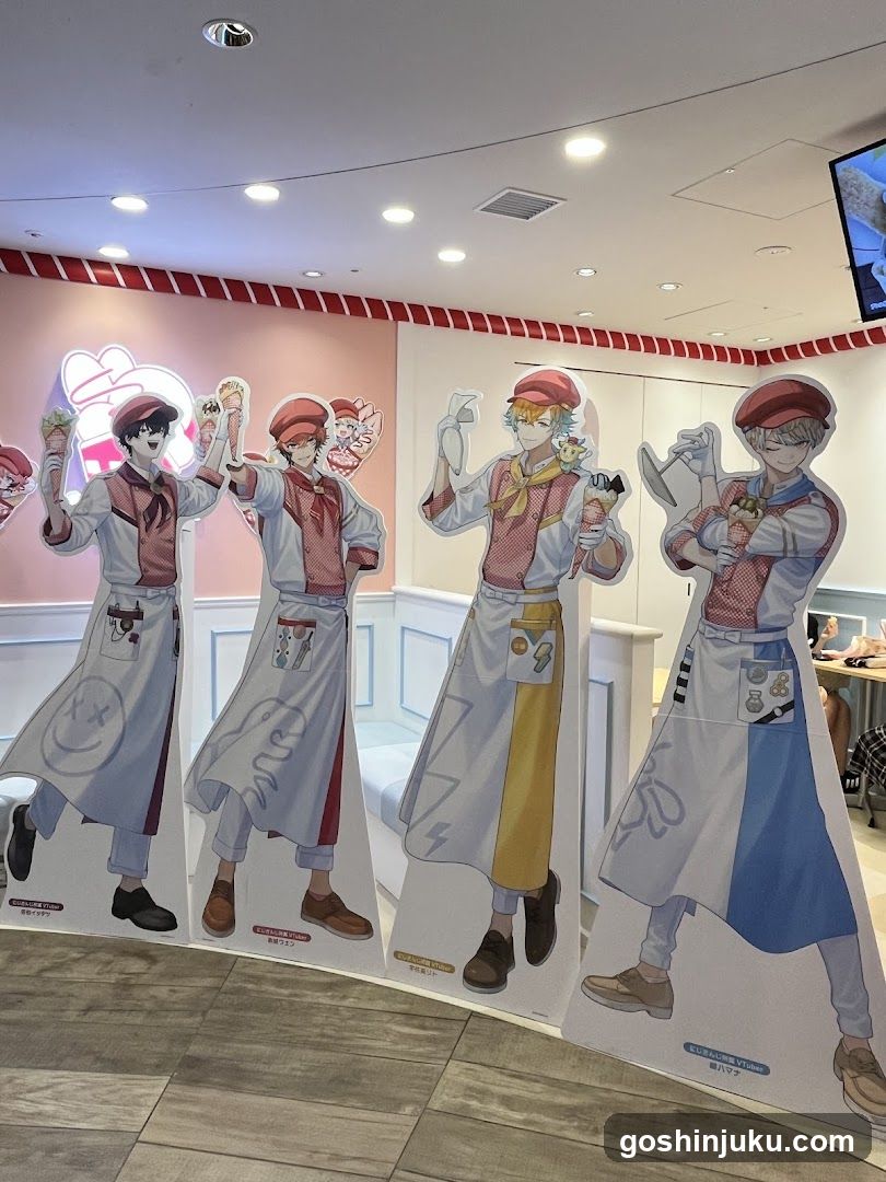 Anime-style character cutouts in a cafe interior