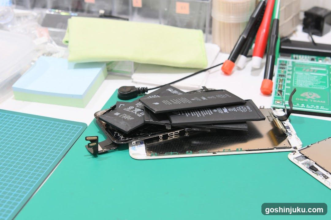 Disassembled iPhone Parts on Workbench